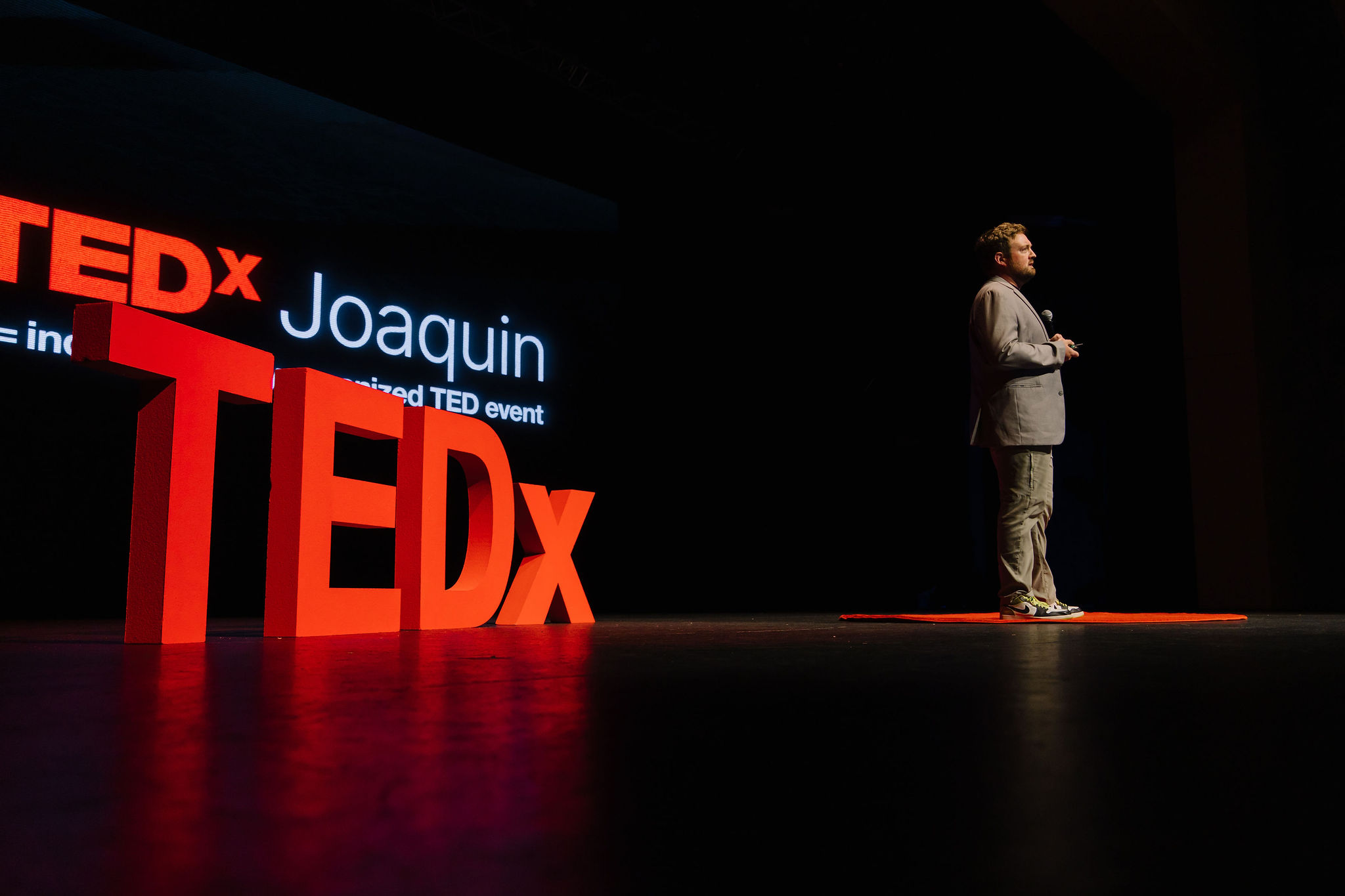 Nate Webb speaking on stage